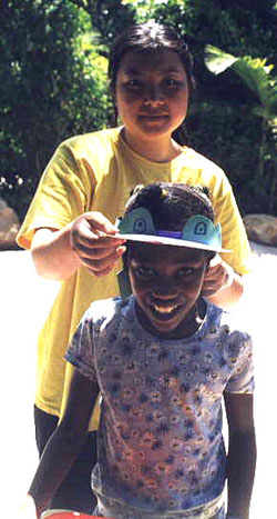 child wearing wide brimmed hat