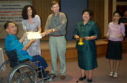 Dr. Sax, along with co-instructor Tony Langton, presenting certificates to participants after completion of Assistive Technology training at Ratchasuda College, Mahidol University, Bangkok, Thailand.